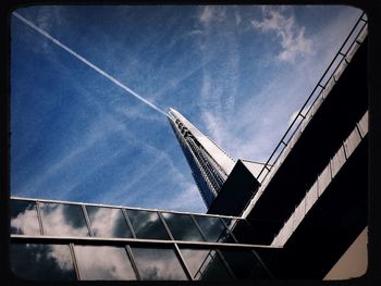 Low angle view of crane against sky