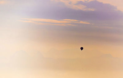 Low angle view of hot air balloon against sky during sunset