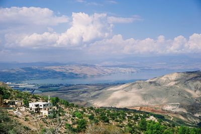 Buildings on mountain against sky