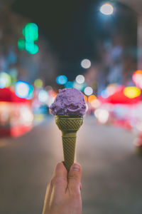 Hand holding ice cream cone