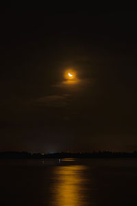 Scenic view of sea against sky at night