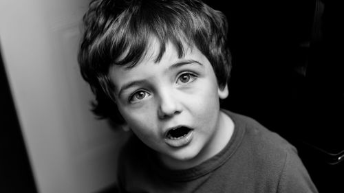 Close-up portrait of shocked boy