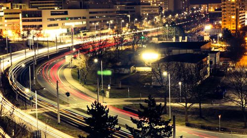 High angle view of light trails on road at night