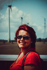 Portrait of woman wearing sunglasses against sky