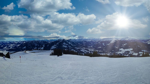 Scenic view of snow covered mountains against sky