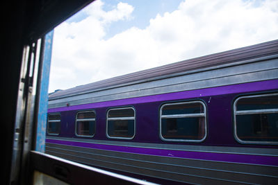 Train at railroad station against sky