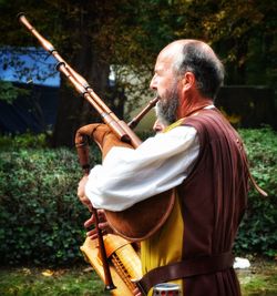 Rear view of man playing outdoors