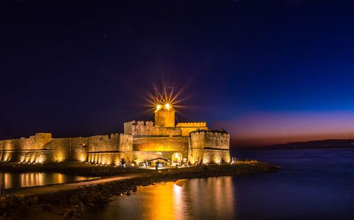 Illuminated castle at night