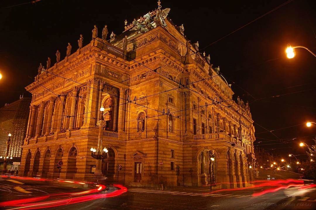 illuminated, night, architecture, built structure, building exterior, city, street, motion, transportation, light trail, long exposure, travel destinations, road, street light, no people, travel, mode of transportation, speed, history, nature