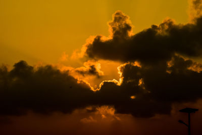 Low angle view of dramatic sky during sunset