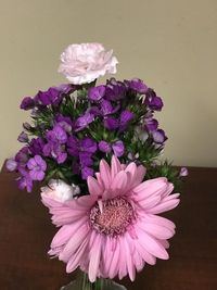 Close-up of pink daisy flower vase on table