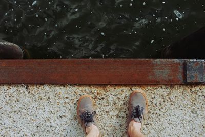 Low section of person standing on ground