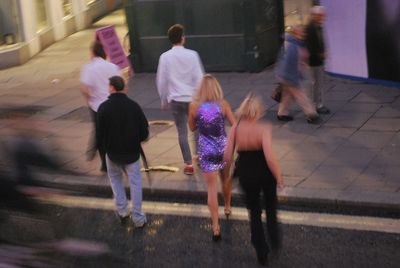 Blurred people walking outdoors