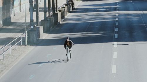 Full length of woman standing on wall