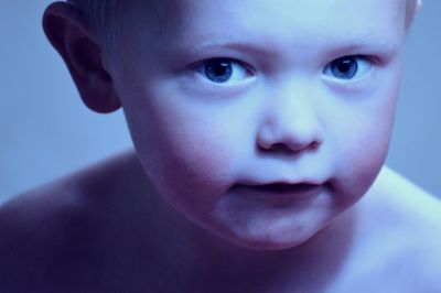 Close-up portrait of shirtless boy