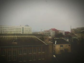 Buildings in city against sky