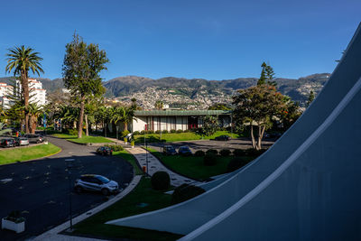 View of swimming pool by buildings against sky