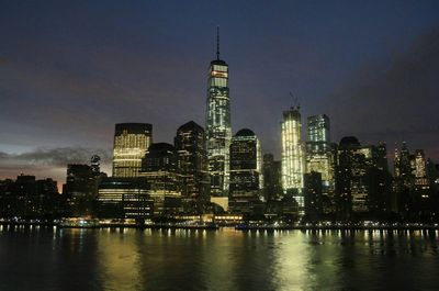 View of skyscrapers lit up at night