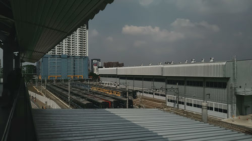 Train at railroad station against sky