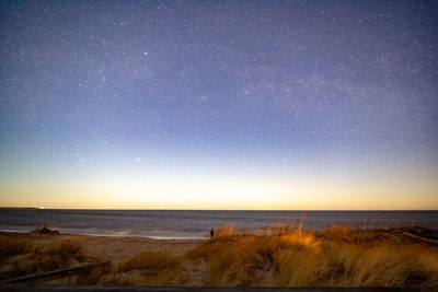 Scenic view of sea against sky at night