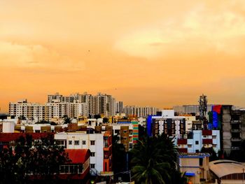 Cityscape against sky during sunset