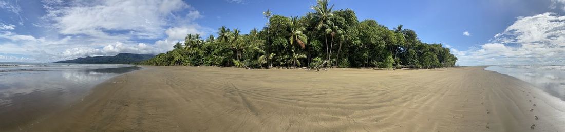 Panoramic view of beach against sky