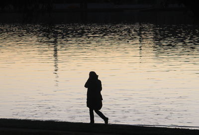 Silhouette woman standing in water