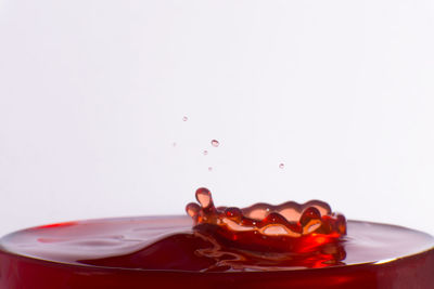Close-up of drink against white background