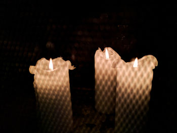 Close-up of illuminated lamp in darkroom