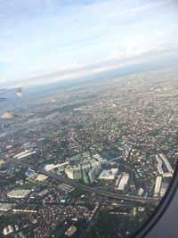 Aerial view of cityscape against sky