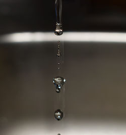 Close-up of water falling from faucet