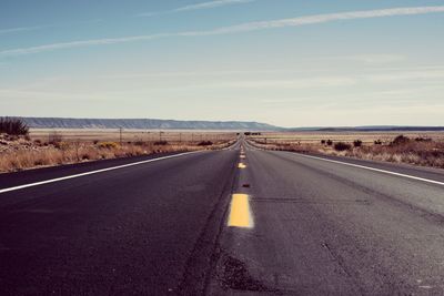 Road on landscape against sky