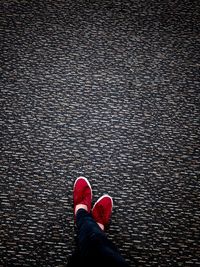 Low section of man standing on floor