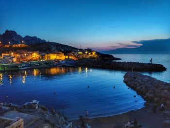 Scenic view of sea against sky at dusk