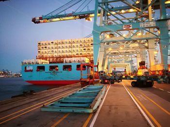 Traffic on road against sky in city
