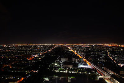 High angle view of illuminated cityscape at night