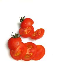 Close-up of red chili over white background