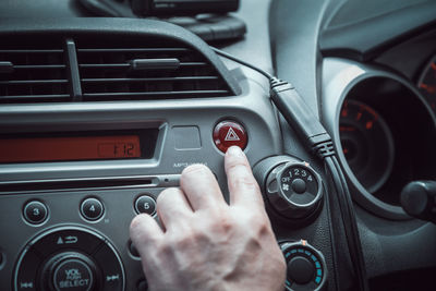 Cropped image of man driving car