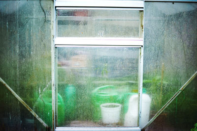 Reflection of old window in glass building