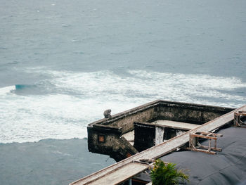 High angle view of swimming pool by sea against sky