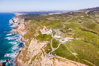 High angle view of sea and mountains against sky