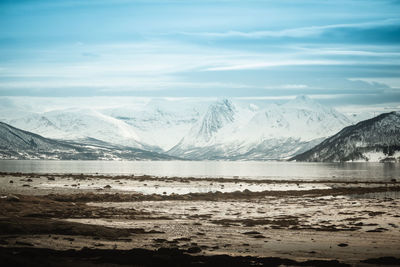 Scenic view of snowcapped mountains against sky