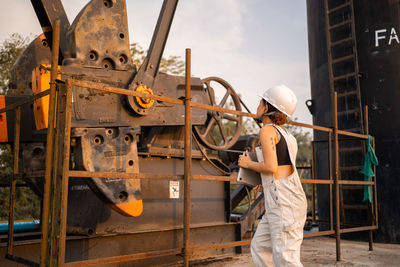 Rear view of man working at construction site