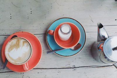 High angle view of coffee cups on table