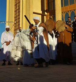 Group of people on street in city