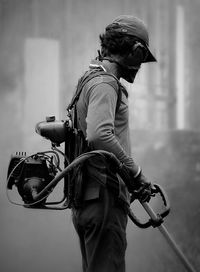 Side view of man working outdoors