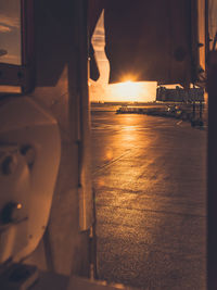 Close-up of car against sky during sunset