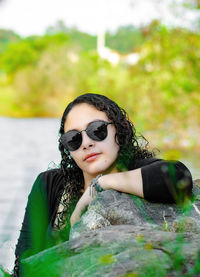 Portrait of young woman wearing sunglasses