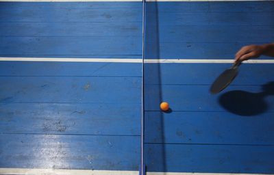 High angle view of person playing table tennis