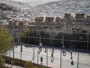 High angle view of people playing in city
